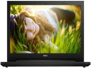 The Dell laptop is open and has a woman laying on it.