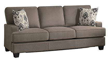 The couch is made with a light colored fabric.