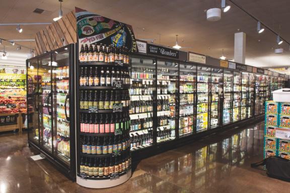 The store has several aisles and displays for beverages.