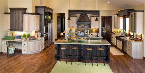 A kitchen with wood floors and cabinets.
