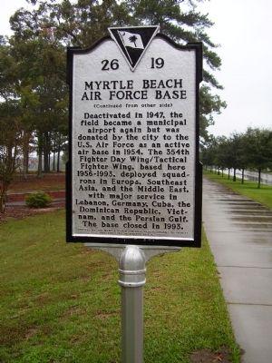 The sign is in front of the park.